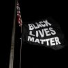 Protesters hang a Black Lives Matter Flag at Florissant Police department during a protest against the police brutality of a man hit by a Florissant detective and the death in Minneapolis police custody of George Floyd, in Florissant, Missouri, U.S. June 10, 2020. REUTERS/Lawrence Bryant