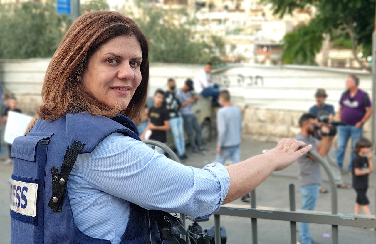 This handout file picture obtained from a former colleague of Al-Jazeera's late veteran TV journalist Shireen Abu Aqleh (Akleh), shows her reporting from Jerusalem on June 12, 2021. - Al-Jazeera said Abu Aqleh, 51, a prominent figure in the channel's Arabic news service was shot dead by Israeli troops early on May 11, 2022 as she covered a raid on Jenin refugee camp in the occupied West Bank. But Israeli Prime Minister Naftali Bennett said it was "likely" that Palestinian gunfire killed her. (Photo by HANDOUT / AFP) / RESTRICTED TO EDITORIAL USE - MANDATORY CREDIT "AFP PHOTO / " - NO MARKETING NO ADVERTISING CAMPAIGNS - DISTRIBUTED AS A SERVICE TO CLIENTS