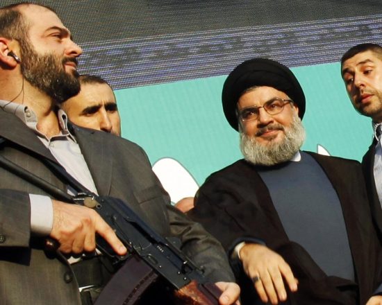 Lebanon's Hezbollah leader Sayyed Hassan Nasrallah (2nd R), escorted by his bodyguards, greets his supporters at an anti-U.S. protest in Beirut's southern suburbs, in this September 17, 2012 file photo. European Union governments agreed on July 22, 2013 to put the armed wing of Hezbollah on the EU terrorism blacklist in a reversal of past policy fuelled by concerns over the Lebanese militant movement's activities in Europe. REUTERS/Sharif Karim/Files (LEBANON - Tags: POLITICS CIVIL UNREST)