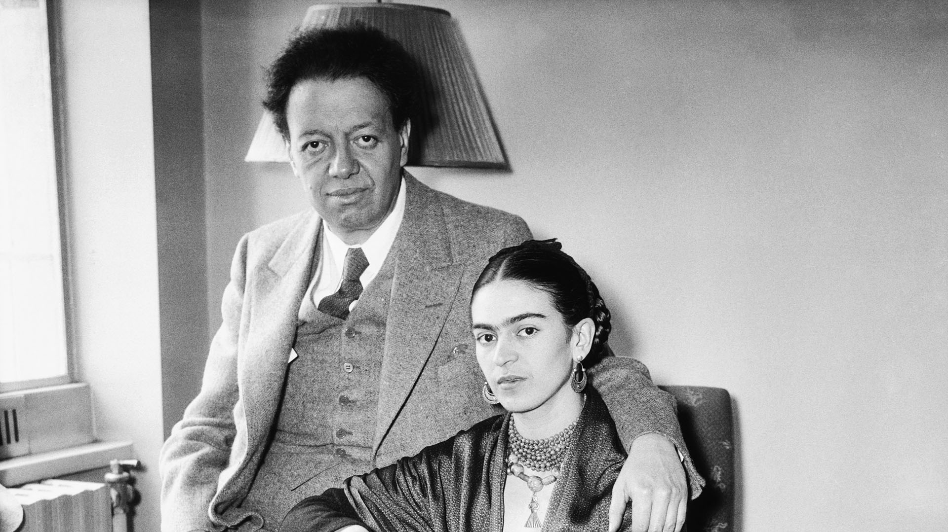 (Original Caption) 12/8/1939-Mexico City, Mexico- Diego Rivera, celebrated artist and dissident Communist, who charged, Dec. 8, that German Nazis and Stalin Communists were "converging" Mexico into a base of operations against all of the Americas, especially Mexico and the United States. He is pictured here with his wife, Mexican painter Frida Kahlo.